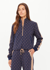 THE UPSIDE women's monogram jacquard Ezra Morgan Quarter Zip features elasticated cuffs, drawcord hem, and front pockets. Made for lifestyle.