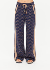 THE UPSIDE women's monogram jacquard Ezra Nova Flare Pant features a monogram geometric design and an elasticated waistband with drawcord. Made for lifestyle.