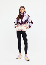 THE UPSIDE women’s recycled Harlow Fleece Pullover is designed for a relaxed fit and features a quarter zip front, zip pockets, elasticated waist and cuffs in our geometric star jacquard print. Made for lifestyle.