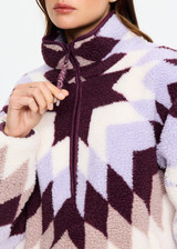 THE UPSIDE women’s recycled Harlow Fleece Pullover is designed for a relaxed fit and features a quarter zip front, zip pockets, elasticated waist and cuffs in our geometric star jacquard print. Made for lifestyle.