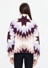 THE UPSIDE women’s recycled Harlow Fleece Pullover is designed for a relaxed fit and features a quarter zip front, zip pockets, elasticated waist and cuffs in our geometric star jacquard print. Made for lifestyle.