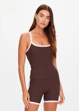 THE UPSIDE women's chocolate Rhythm Caleb Tank Top features a scooped front neckline with t-bar back and removable cups in our recycled rib fabrication. Made for yoga and pilates.