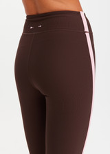 THE UPSIDE women's chocolate Rhythm 25inch Legging is mid-rise and features cream and pink binds along side seams in our recycled rib fabrication. Made for yoga and pilates.