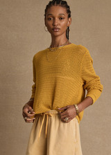 THE UPSIDE women's yellow Felice Knit Crew is designed for a regular fit and features an open knit construction, rolled neckline and arrow logo on sleeve. Made for lifestyle.