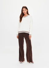 THE UPSIDE women's cream Millie V Neck Knit Sweater is designed for a relaxed fit and features a high v neckline and chocolate metallic stripes along cuffs, neckline and hem. Made for lifestyle.