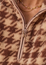 THE UPSIDE women's check recycled Palacio Harlow Fleece Pullover is relaxed fit with quarter-zip woven binds and zip pockets. Made for lifestyle.