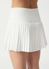THE UPSIDE women’s white Game Karina Pleated Skirt features built-in inner shorts and pockets in recycled, soft-peached fabric. Made for tennis.