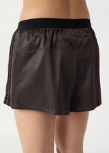 THE UPSIDE women’s brown Levi Run Short is a mid-rise style with a curved hem, ribbed elastic waistband and black mesh tape. Made for running.