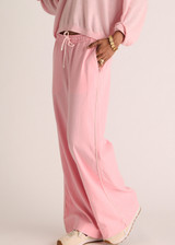 THE UPSIDE women’s pink Cortina Elita Pant is a mid-rise style with a soft elastic waistband, slanted side-seam pockets and cream piping. Made for lifestyle.