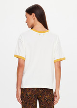 THE UPSIDE women’s natural organic cotton Morning Jacob Tee is an oversized fit with a butterscotch ribbed collar and pink paracord drawcord. Made for lifestyle.
