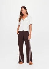 THE UPSIDE women’s natural Elina V Neck Tee is a boxy-fit style featuring a mini chest patch pocket and ribbed neckline with chocolate piping. Made for lifestyle.