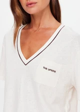 THE UPSIDE women’s natural Elina V Neck Tee is a boxy-fit style featuring a mini chest patch pocket and ribbed neckline with chocolate piping. Made for lifestyle.