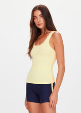 THE UPSIDE women's yellow organic cotton Del Rey Pointelle Tank Top features a scooped front and back neckline, and ruffle lace edge tonal trim. Made for lifestyle.