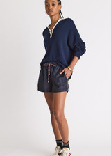 THE UPSIDE women's stripe Wool Iggy Short is a relaxed, mid-rise fit and features cream piping along side seams and maroon paracord drawcord. Made for lifestyle.
