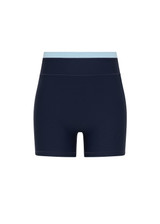 THE UPSIDE women's navy recycled nylon Hermosa 4 Inch Spin Short is mid rise and features a light blue stripe at upper waistband and pockets at the side. Made for yoga and pilates.