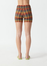THE UPSIDE women's check Del Sol 4 Inch Spin Short is mid rise and features a navy elastic drawcord with aglets and is fully lined. Made for yoga and pilates.