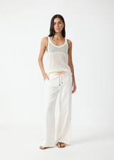 THE UPSIDE women's cream La Paz Malika Wide Leg Pant is a mid-rise straight leg fit and features an elasticated back waistband, an orange drawcord, an embroidered palm tree motif and side seam pockets. Made for lifestyle.