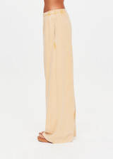 THE UPSIDE women's yellow Soho Tokio Wide Leg Pant is designed for a relaxed fit and features an elasticated waistband, front pockets and embroidered arrow logo. Made for everyday.