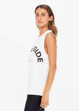 THE UPSIDE women's white Muscle Tank is made of organic cotton jersey. It features low-cut arm openings, rolled bind detail at the sleeve and a white horsehoe logo at the centre front.