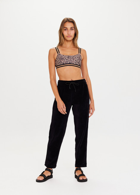 THE UPSIDE La Lune Franca Pant in Black is a straight leg track style pant in plush velour with knitted tape detailing, pockets and elastic waistband with drawcord.