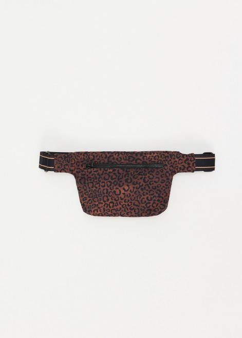 THE UPSIDE Malo Belt Bag in Leopard print is a recycled belt bag with a striped adjustable strap, magnetic snap button closure and pockets.