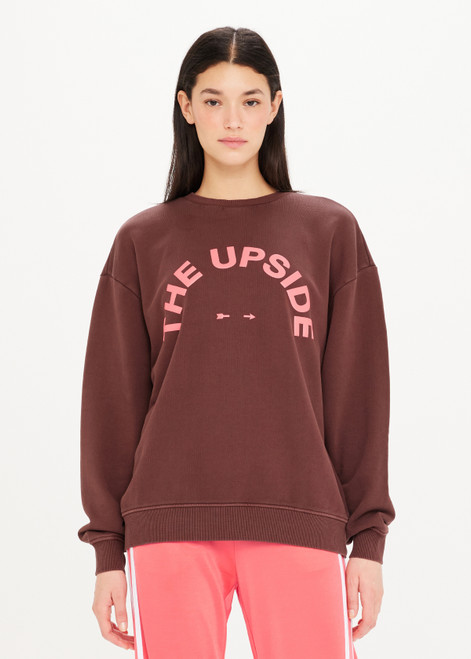 THE UPSIDE Saturn Crew in Chocolate Brown is a sustainable organic cotton relaxed and oversized crew with our printed horseshoe logo at front chest in pink and ribbed cuff and neckline.