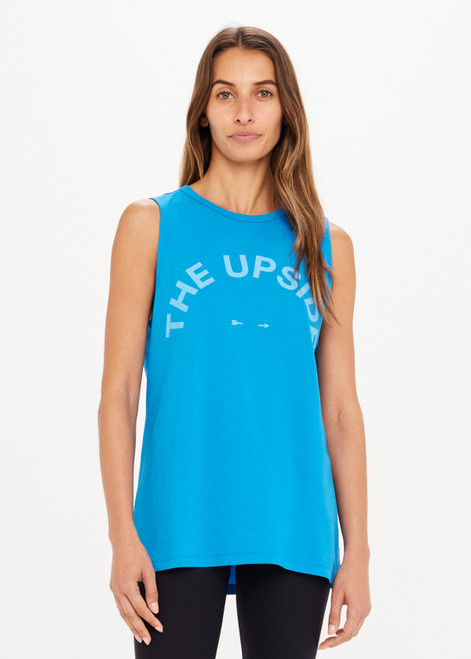 THE UPSIDE Tara Tank in Blue is an organic cotton sleeveless top with a long line silhouette and a large tonal horsehoe logo print at the centre front.