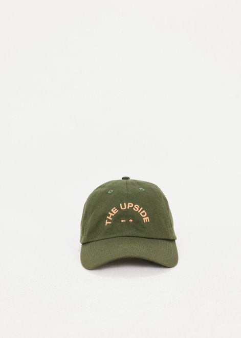 THE UPSIDE Basecamp Soft Cap in Olive Green is a sustainable organic cotton soft retro fit cap with our embroidered horseshoe logo at front and adjustable velcro strap at back.