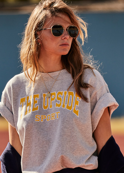 THE UPSIDE Ivy League Sam Tee in Grey Marle is a sustainable organic cotton oversized tee with a ribbed neckline and Ivy League THE UPSIDE Sport logo printed on chest.