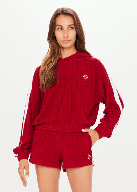 THE UPSIDE Collegiate Gia Crop Hoodie in Red is a cropped hoodie in our monogram TU terry towelling with contrast white tape down sleeves and embroidered arrow badge.