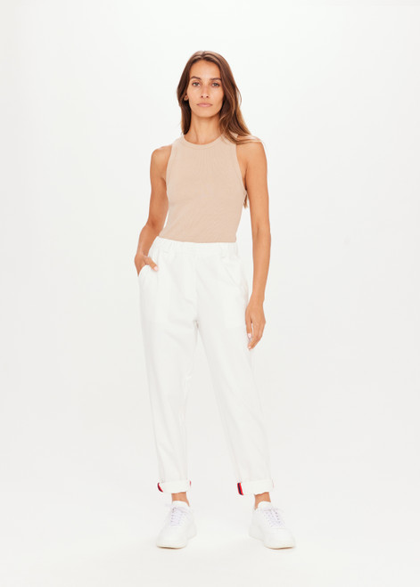 THE UPSIDE Boston Pant in White is a relaxed pant with a rolled hem and stripe tape detail, pockets and elastic at waistband.