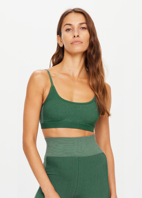 THE UPSIDE womens two-toned green pine/matcha Ribbed Seamless Ballet Bra made with Ribbed Seamless fabric features low coverage soft support, adjustable elastic straps and moisture control properties.