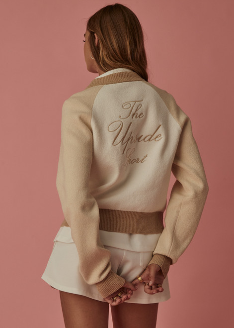 THE UPSIDE womens white/beige/neutral Rodeo Hallie Knit Bomber features welt pockets, contrast sleeves and knitted rib at hem, neck and cuffs.