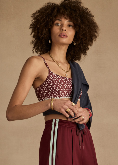 THE UPSIDE women's floral Firefly Hutton Scoop Bra is mid coverage with scoop front, adjustable straps, removable bust cups and shelf bra. Made for pilates.
