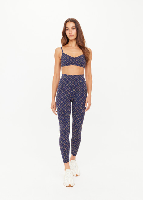 THE UPSIDE women's monogram jacquard Ezra 25inch High Midi Legging offers firm and supportive fit with V panel waistband. Made for yoga and pilates.
