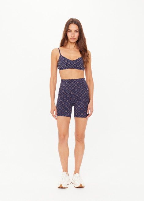 THE UPSIDE women's monogram jacquard Ezra 5inch High Spin Short is high-rise with a V panel waistband. Made for yoga and pilates.