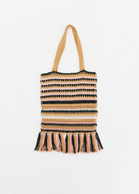 THE UPSIDE women's stripe Bohemia Kelly Crochet Bag is an organic hand-crochet tote with knotted tassel details and wooden beads. Made for lifestyle.