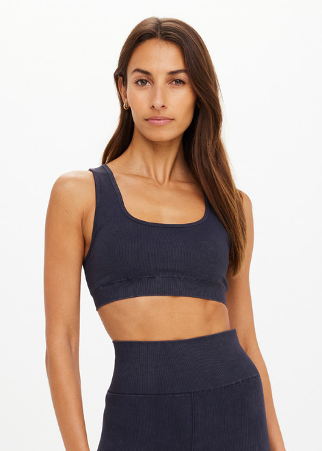 THE UPSIDE women's black Seamless Jade Racerback Bra offers a soft & comfortable fit and features removable cups in a rib fabrication. Made for yoga & pilates.