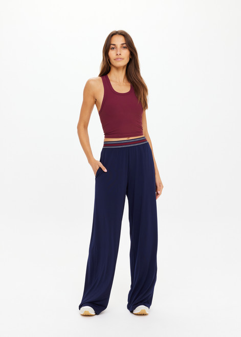 THE UPSIDE women's navy recycled polyester Harlan Wide-Leg Pant is designed for a true-to-size fit and features side-seam pockets and a striped elastic waistband. Made for lifestyle.
