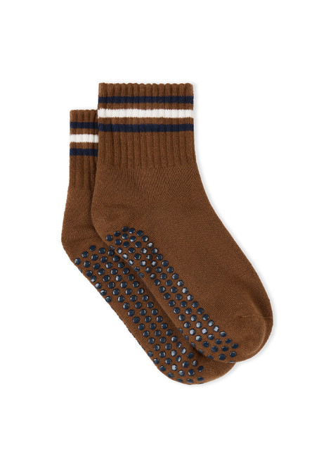 THE UPSIDE women's walnut brown Avalon Grip Sock features an anti-slip sole with midi ankle height, designed with navy and cream stripes, grip and logo. Made for yoga & pilates.