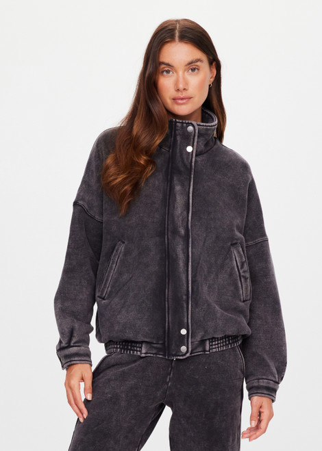 THE UPSIDE women's washed black Cosmic Carmen Moto Jacket is designed for a relaxed fit and features welt pockets and a soft elasticated hem. Perfect everyday outerwear piece.
