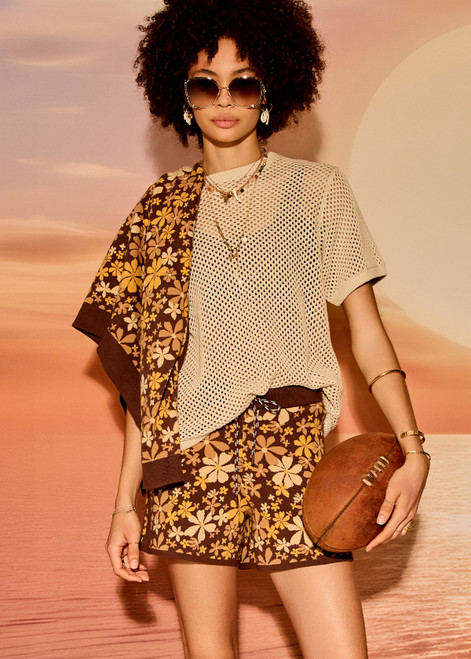 THE UPSIDE women's floral organic cotton Copacabana Leon Knit Short features a soft and supportive fit, side stripes, zip pockets and a drawcord waistband. Made for lifestyle.