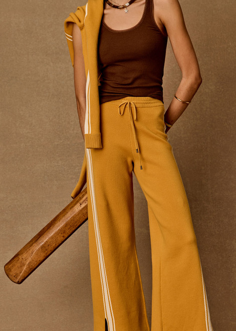 THE UPSIDE women's yellow organic cotton Bonito Moby Knit Pant is designed for a soft and supportive fit and features a high rise waist, side stripe detailing and adjustable drawcord. Made for lifestyle.