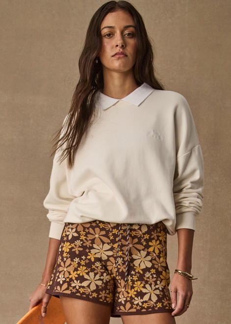 THE UPSIDE women's natural organic cotton Pascal Collared Crew offers a relaxed fit and features a collared neckline, scalloped edge detailing and ribbed trims. Made for lifestyle.