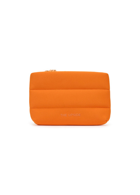 THE UPSIDE orange La Paz Cosmetic Pouch features printed palm tree lining, a chunky zipper closure with neon paracode and raised The Upside logo on the front.