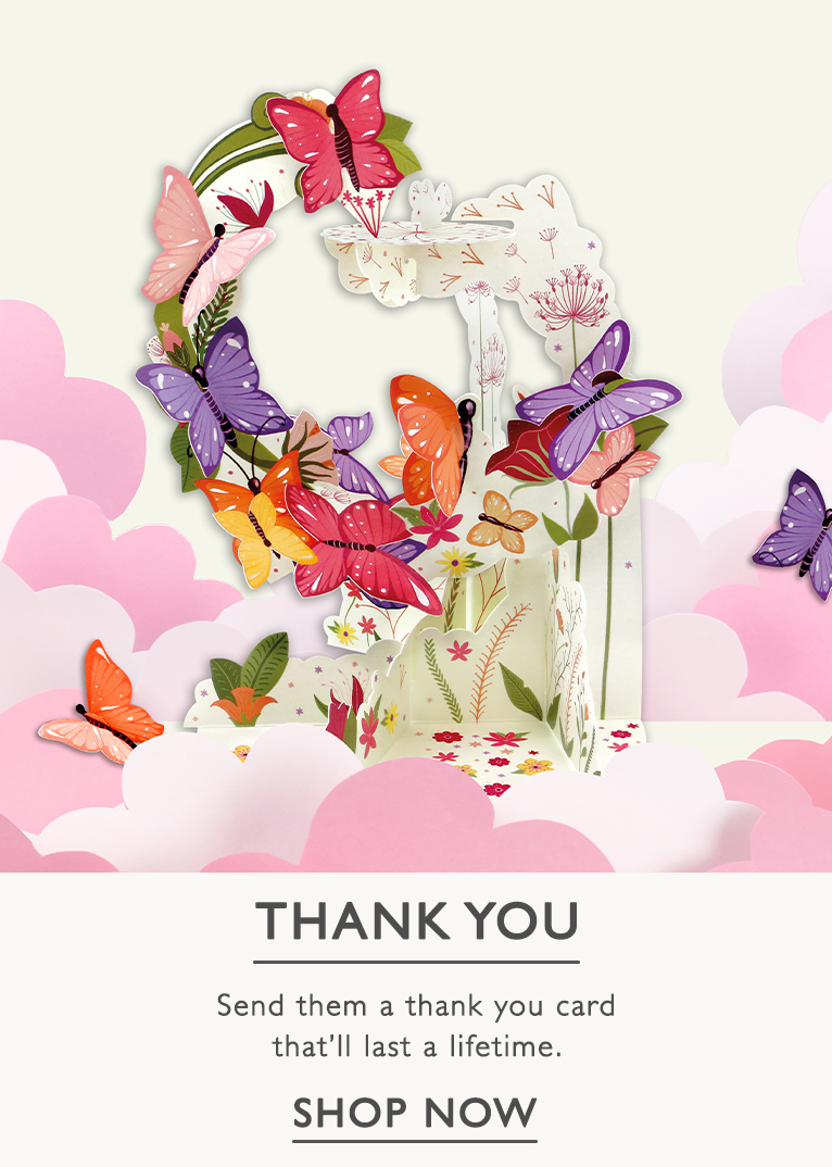 A 3D  pink and purple butterfly card with a button to shop thank you cards