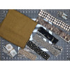 Elegance Log Cabin Quilt Kit fabrics in black, cream, and brown