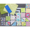 Cutie Pie Pinwheel Star Quilt Kit fabrics and pieces on cutting mat