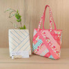 Pink Alexandra tote bag displayed beside Quilt As You Go batting package