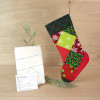 Holiday square stocking kit with stocking, batting foundation, and instructions